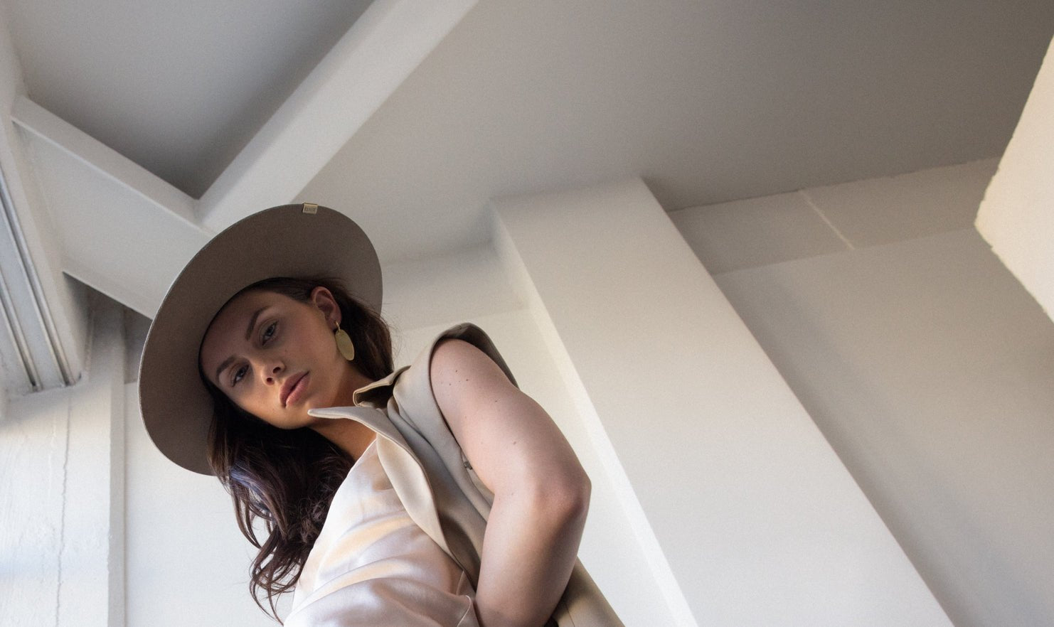 A grey urban wool felt hat with a structured brim