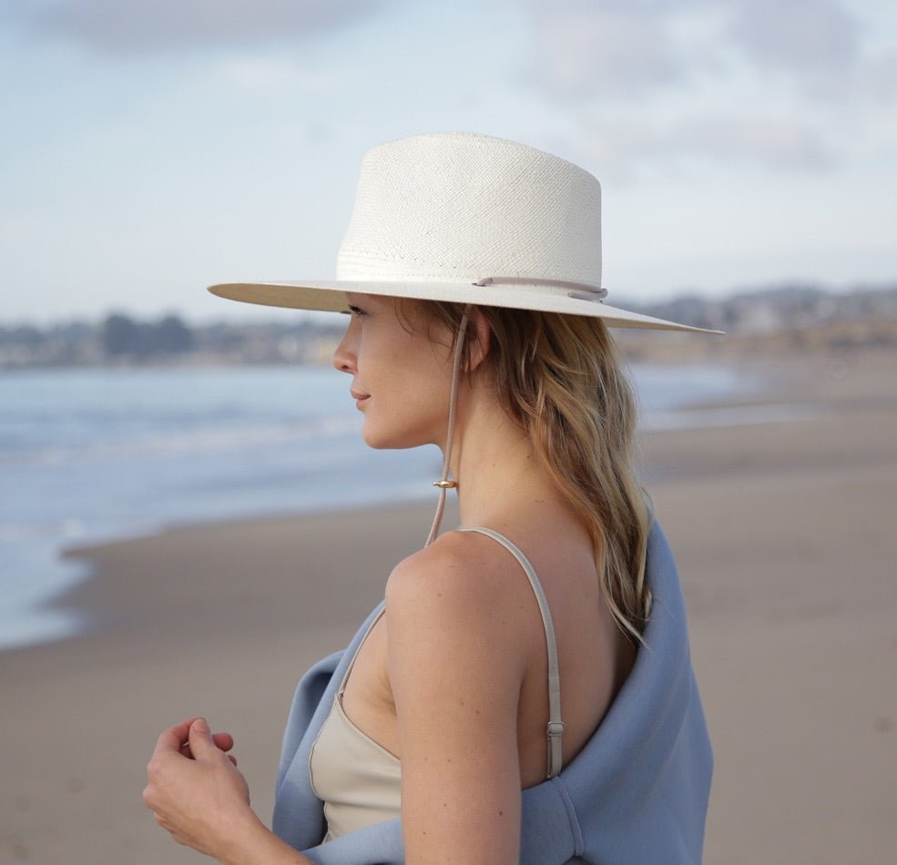 Cream straw hat with shin strap and large crown