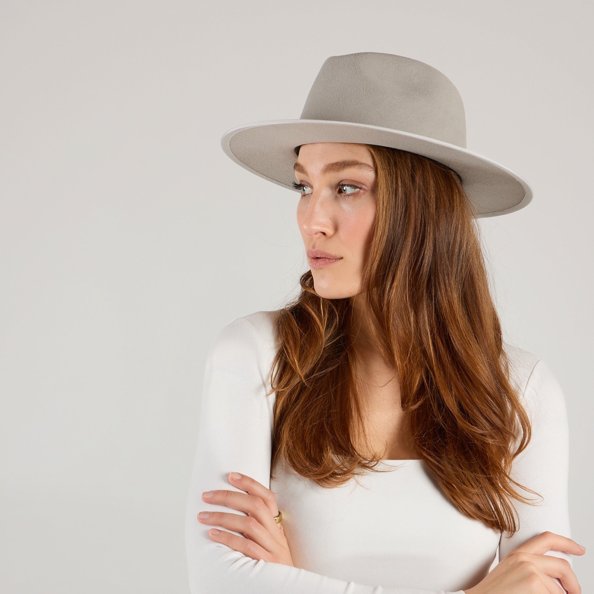 woman wearing a gray wool felt hat