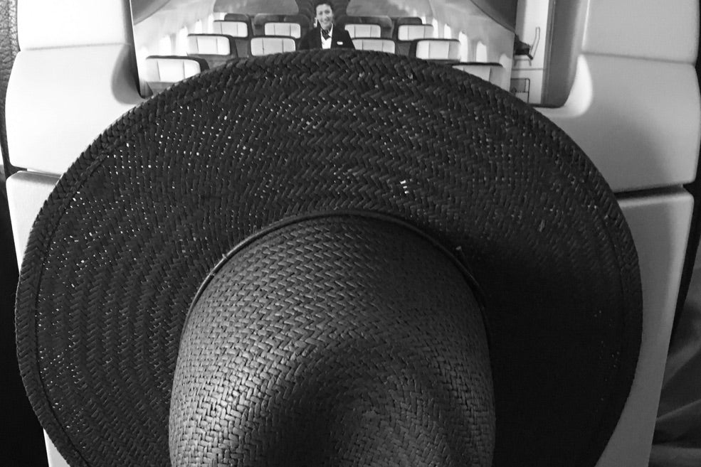 ridged dark coloured straw hat 