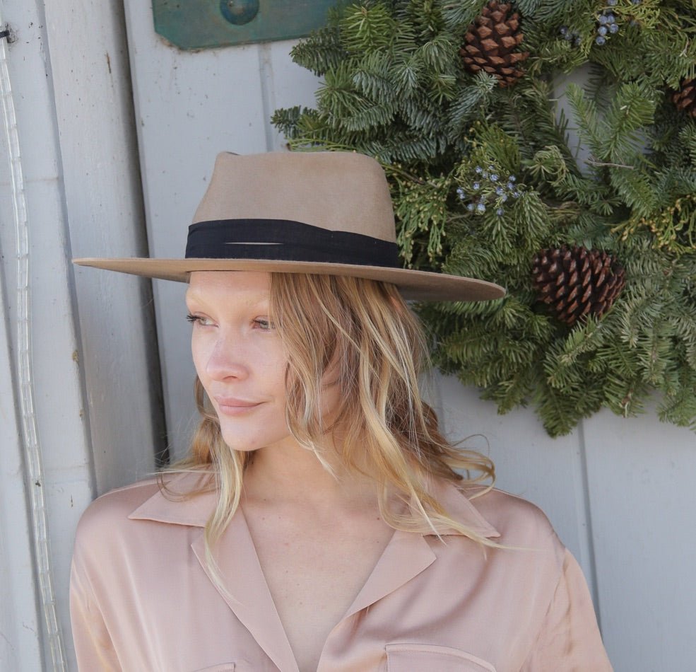 Brown felt wool hat with flat brim and black material accent 