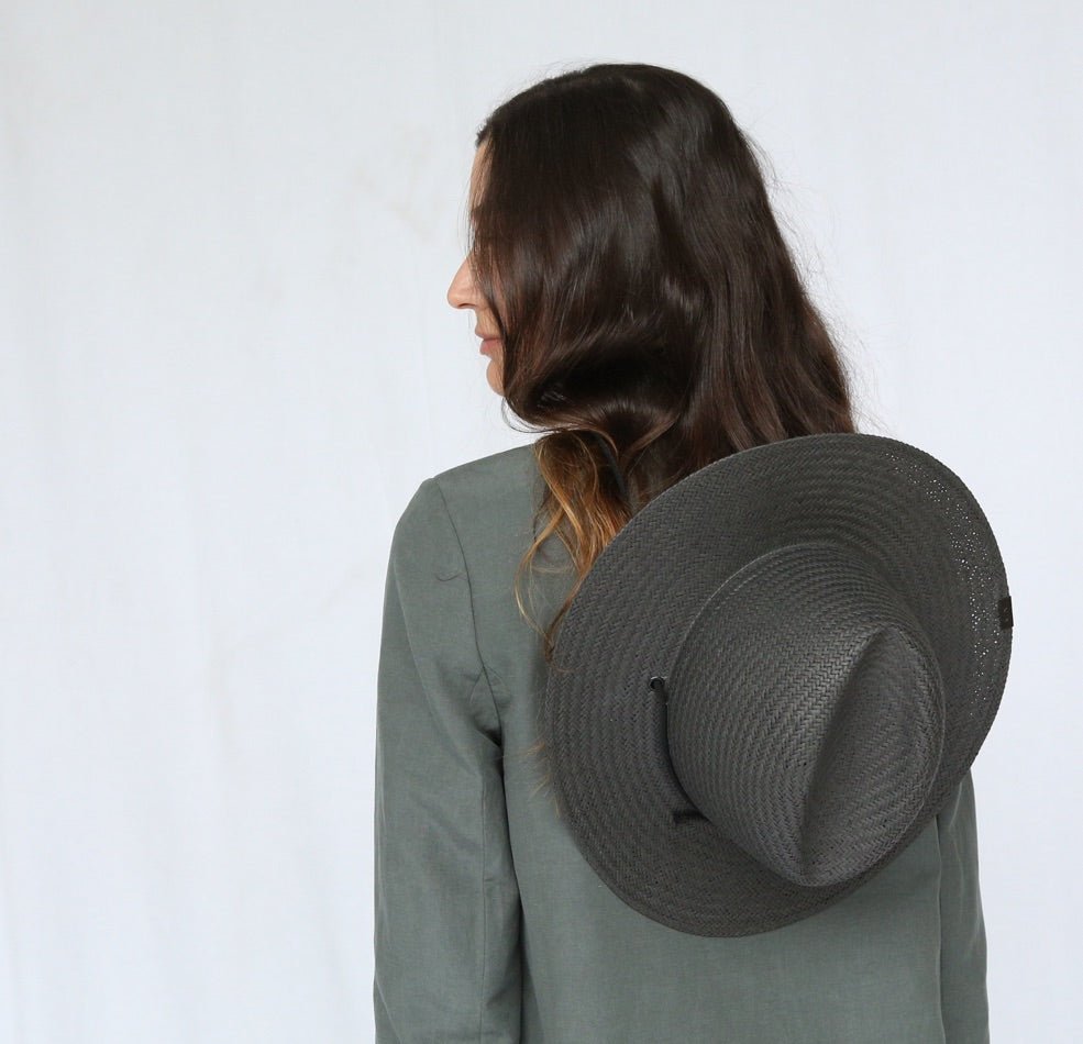 Modern grey straw hat with medium-length brim and metal accent 