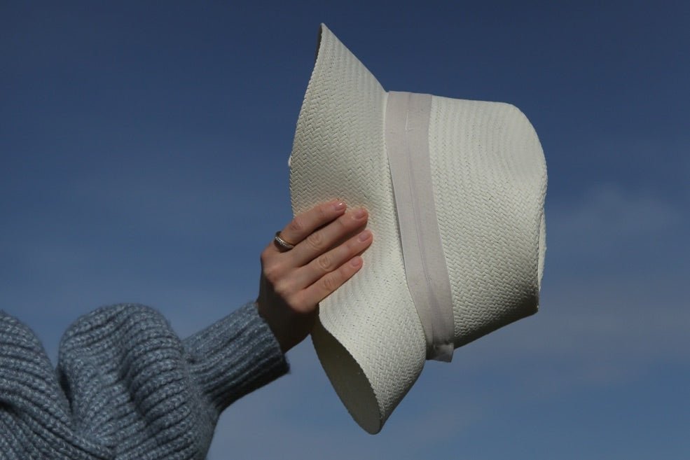 flexible white straw hat with felt accent band 